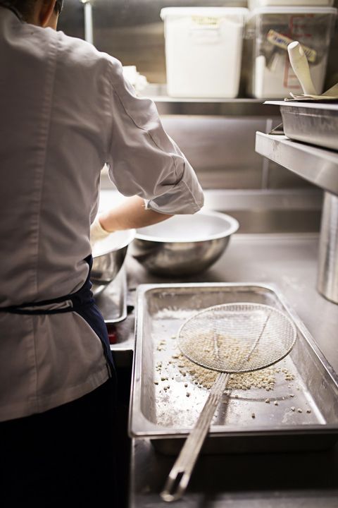 Convivial chef working in kitchen